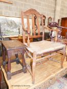 An early 18th century oak rectangular topped stool and an oak lathe back elbow chair (2)
