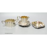 A collection of assorted silver to include a Persian pierced white metal dish, an 800 standard jug