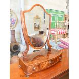 A George III banded mahogany bow front box base three drawer toilet mirror, width 59cm, depth 30cm,