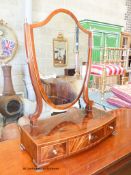 A George III banded mahogany bow front box base three drawer toilet mirror, width 59cm, depth 30cm,