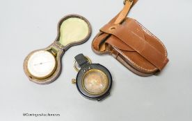 A small leather-cased military compass together with a cased compensated pocket barometer, E.Bryan,