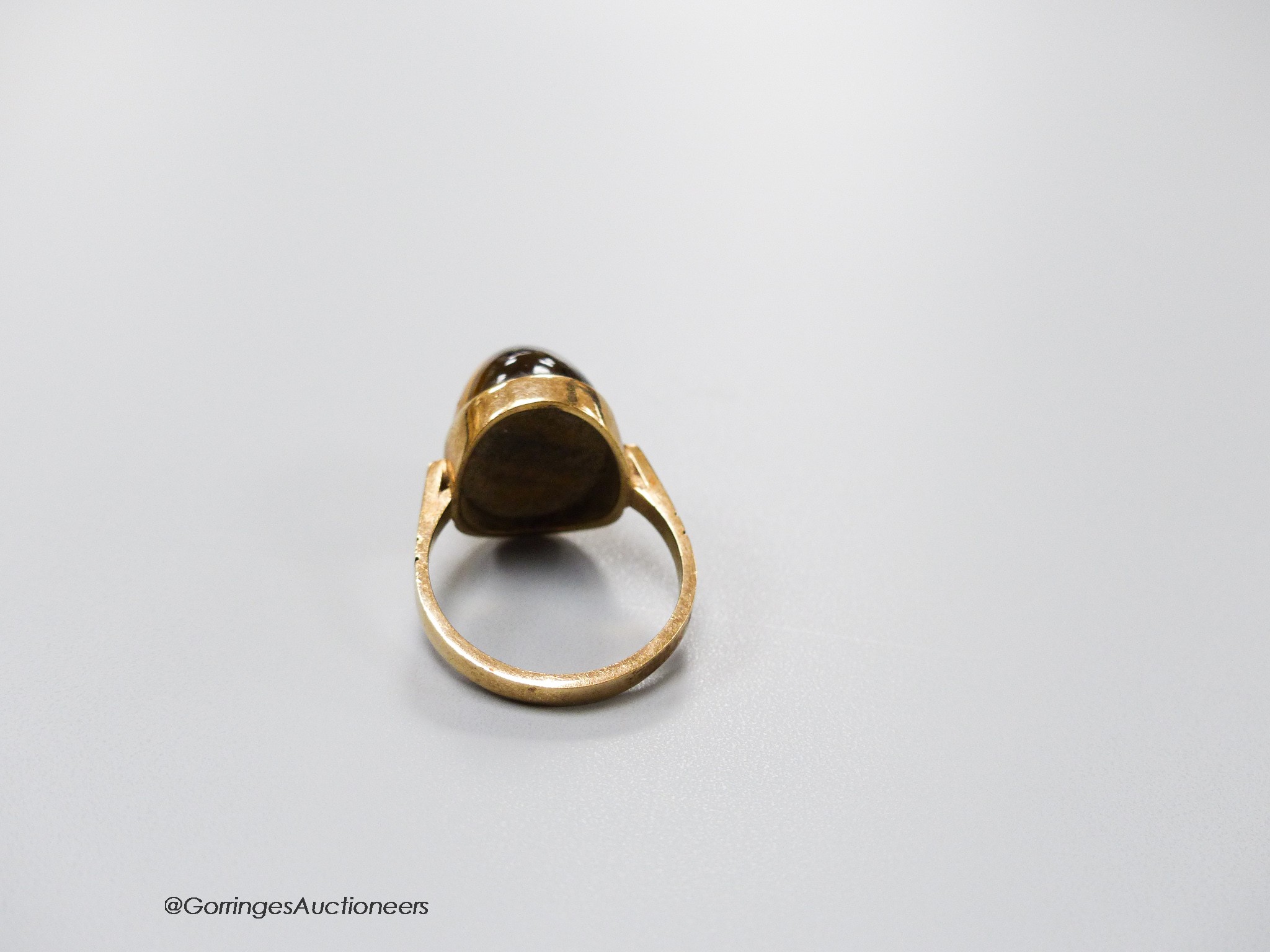 A 9ct and cabochon tiger's eye quartz set dress ring, size O, gross 5.4 grams. - Image 2 of 3
