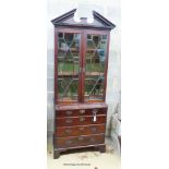 A George III style mahogany bookcase/gun cabinet, W.78cm D.41cm H.212cm