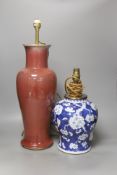 A large Chinese sang de boeuf lamp base and a similar blue and white prunus lamp base, both Qing