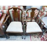 A pair of Queen Anne style mahogany elbow chairs