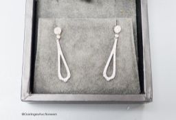 A modern pair of Rox 18ct white gold and diamond cluster set teardrop shaped loop drop earrings,