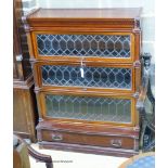 A Globe Wernicke serpentine mahogany four section bookcase. W.90cm D.33cm H.120cm.