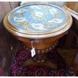 A Victorian walnut work table with circular hinged beadwork top. D-56, H-75cm.