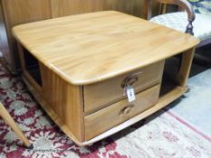 An Ercol elm Windsor storage coffee table, width 78cm, depth 78cm, height 40cm