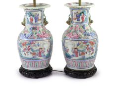 A pair of 19th century Chinese famille rose baluster vases, fitted as table lamps, on hardwood