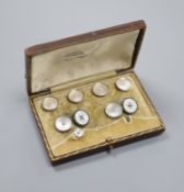 A yellow metal (stamped 18), mother of pearl and seed pearl set six piece part dress stud set and