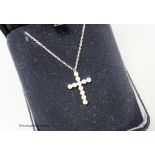 A modern Tiffany & Co platinum and diamond set cross pendant necklace, pendant 18mm, chain 40cm,