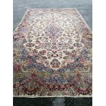 A large Tabriz ivory ground floral carpet, 500 x 300cm