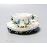 A 19th century Meissen floral encrusted cabinet cup and saucer, decorated with flowers and insects,