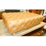 A large Victorian style buttoned tan leather footstool, length 140cm, depth 94cm, height 35cm