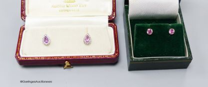 A modern pair of 18ct white gold, pink sapphire and diamond cluster set pear shaped ear studs, 8mm