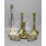 A pair of brass candlesticks, a telescopic candlestick and a silver plated table lamp base