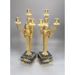 A pair of neo-classical style gilt metal figural candelabra, height 45cm