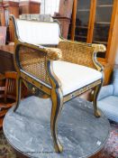 A parcel gilt ebonised elbow chair in the manner of Thomas Hope, width 61cm, depth 57cm, height