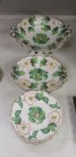 An English porcelain part dessert service, circa 1835 comprising a centrepiece, four serving dishes