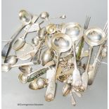 A mixed collection of silver and white metal spoons and other flatware including three 19th century