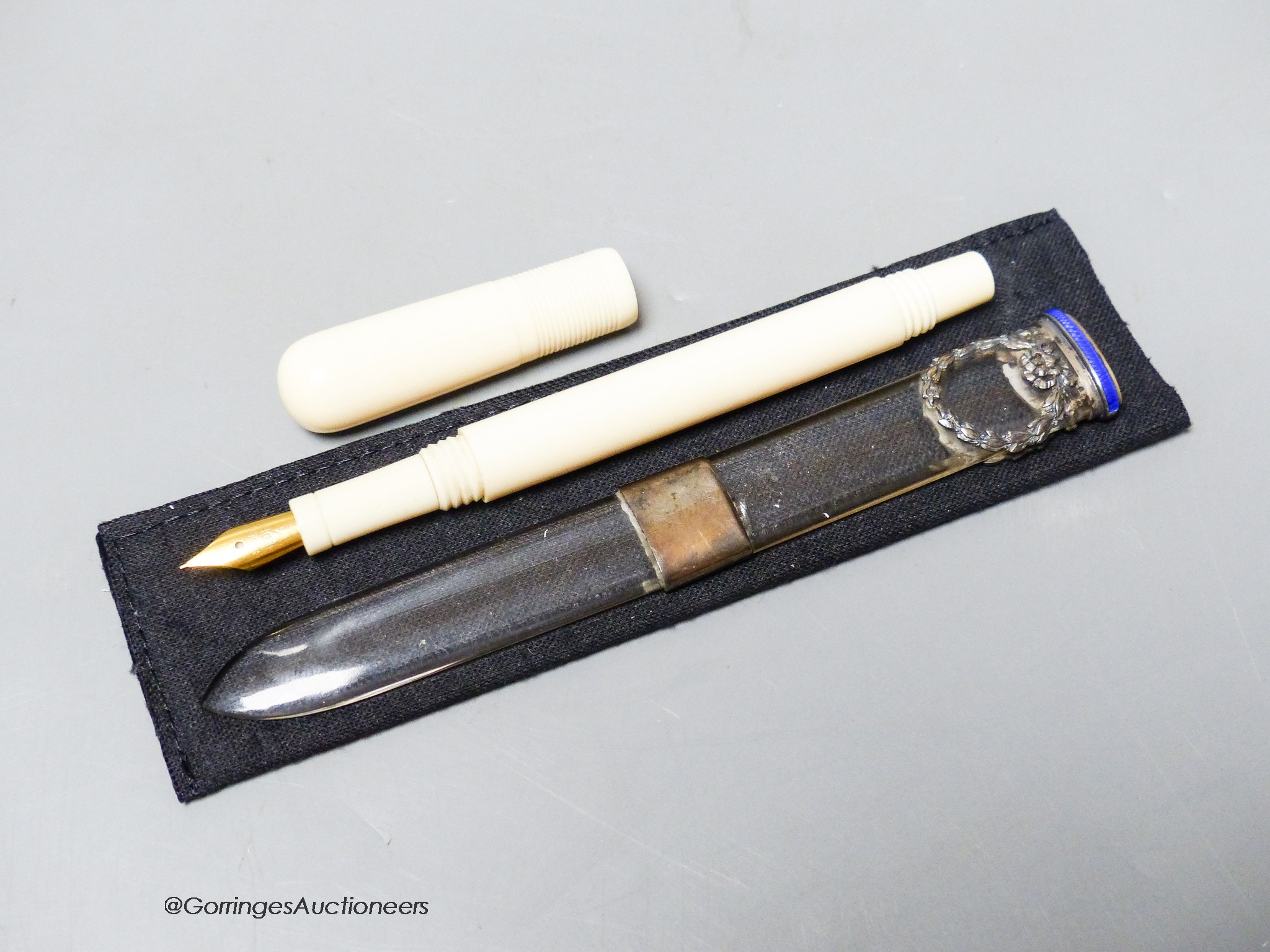 An early 20th century ivory eye dropper pen and an enamelled white metal mounted paperknife - Image 2 of 2