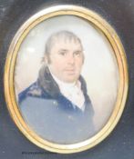 A 19th century portrait miniature, study of a gentleman, in blue tunic with white collar and