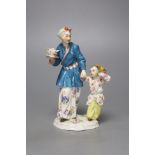 A Meissen group of a Chinese lady and a boy, 20th century, height 14cm