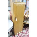 An Ercol elm Windsor narrow CD cabinet, width 35cm, depth 21cm, height 116cm