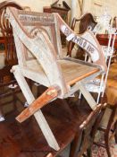 A Glastonbury chair, width 72cm, depth 50cm, height 88cm