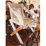 A Glastonbury chair, width 72cm, depth 50cm, height 88cm