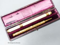 An antique French gold mounted ivory combined pen/pencil and a combined telescopic pen/pencil