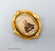 A Victorian yellow metal oval swivelling brooch, 49mm, gross 17.8 grams.