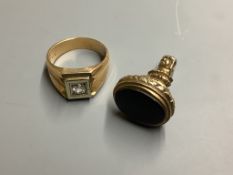 A yellow metal and paste? set signet ring, size U/V, gross weight 14 .1 g, together with a yellow