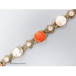 A 14k yellow metal, multi carved cameo and flowerhead set bracelet, including paua shell, shell and