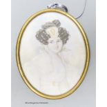 A 19th century portrait miniature, study of a young woman, her hair in ringlets, wearing a lace
