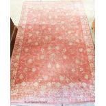 A modern red ground rug, 174 x 116cm