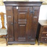 A 17th century German oak cupboard fitted a fielded panelled door, width 109cm, depth 50cm, height