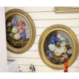 A pair of Victorian reverse painted oval glass flower paintings, 45 x 37cm.