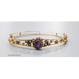 An Edwardian 9ct, amethyst and seed pearl cluster set hinged bracelet, interior diameter 61mm,