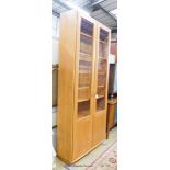 An Ercol Windsor elm two door display cabinet, width 91cm, depth 32cm, height 206cm