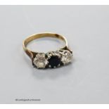 A 9ct gold, sapphire and simulated diamond set three stone ring, size P, gross 2.6 grams.