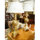 A pair of Italian style gilt table lamps and shades, H.85cm