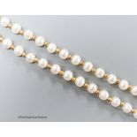 A modern single strand cultured pearl and yellow metal spacer set necklace, the clasp stamped 375,