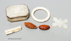 A 19th century panelled mother of pearl box together with a Chinese carved peach stone, a Chinese