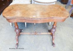A Victorian inlaid figured walnut serpentine folding top card table, width 97cm, depth 52cm, height