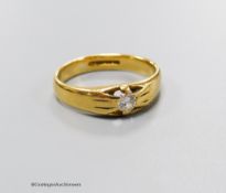 An 18ct gold and claw set solitaire diamond ring, size Q, gross 5.5 grams.