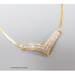 A 10k yellow metal diamond set 'herringbone' necklet, on a 14k yellow metal chain, gross weight 15.