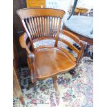 A late Victorian walnut revolving desk chair, width 58cm, depth 52cm, height 92cm