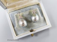 A pair of white metal, cultured Tahitian pearl and diamond cluster set earrings, pearl diameter